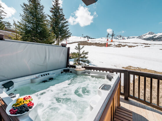 Jacuzzi on the terrace of Chalet Bacchus, in the sunlight.
